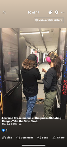 Female instructor coaching a student during live-fire practice at an indoor shooting range