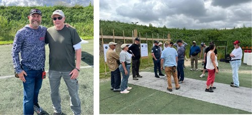 Two men at an outdoor pistol training class beside a group of students gathered on the shooting range.