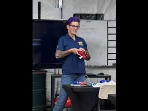 Angela explaining how to use a tourniquet